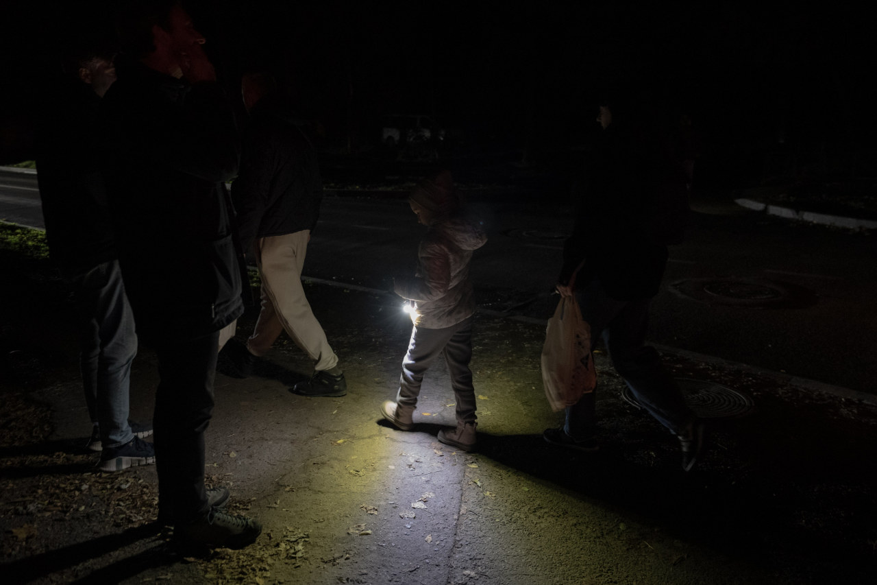 Rolling blackouts mean Chernihiv’s residents rely on phones and flashlights to navigate the streets at night. Rolling blackouts mean Chernihiv’s residents rely on phones and flashlights to navigate the streets at night.