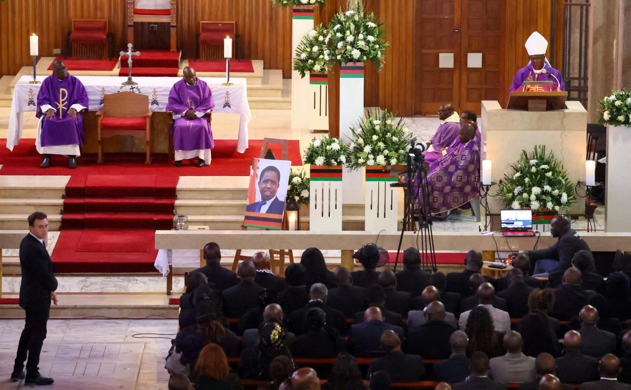 Mourners attend a service in Johannesburg after a court halted the planned burial of Lungu.