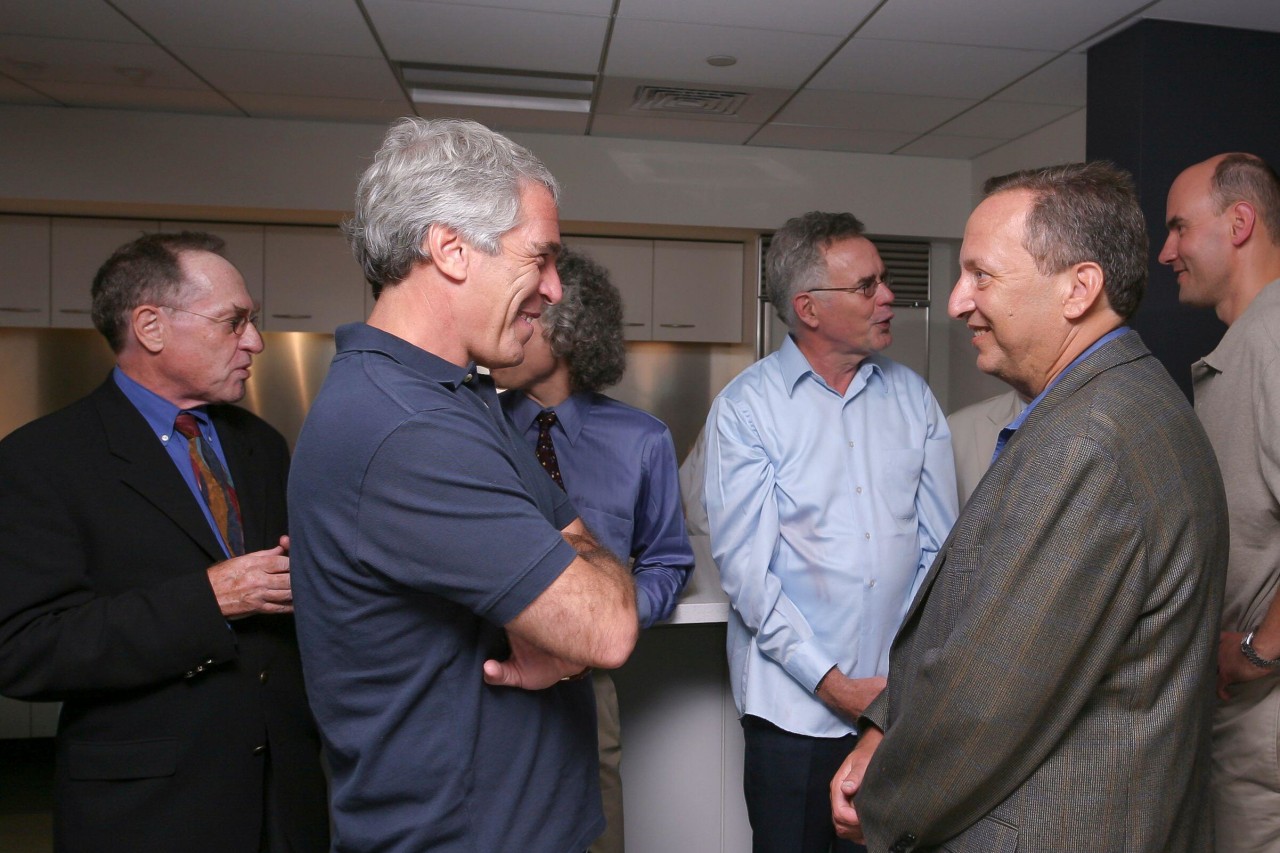Jeffrey Epstein talks to Larry Summers, then Harvard’s president, at a dinner at the university in September 2004.