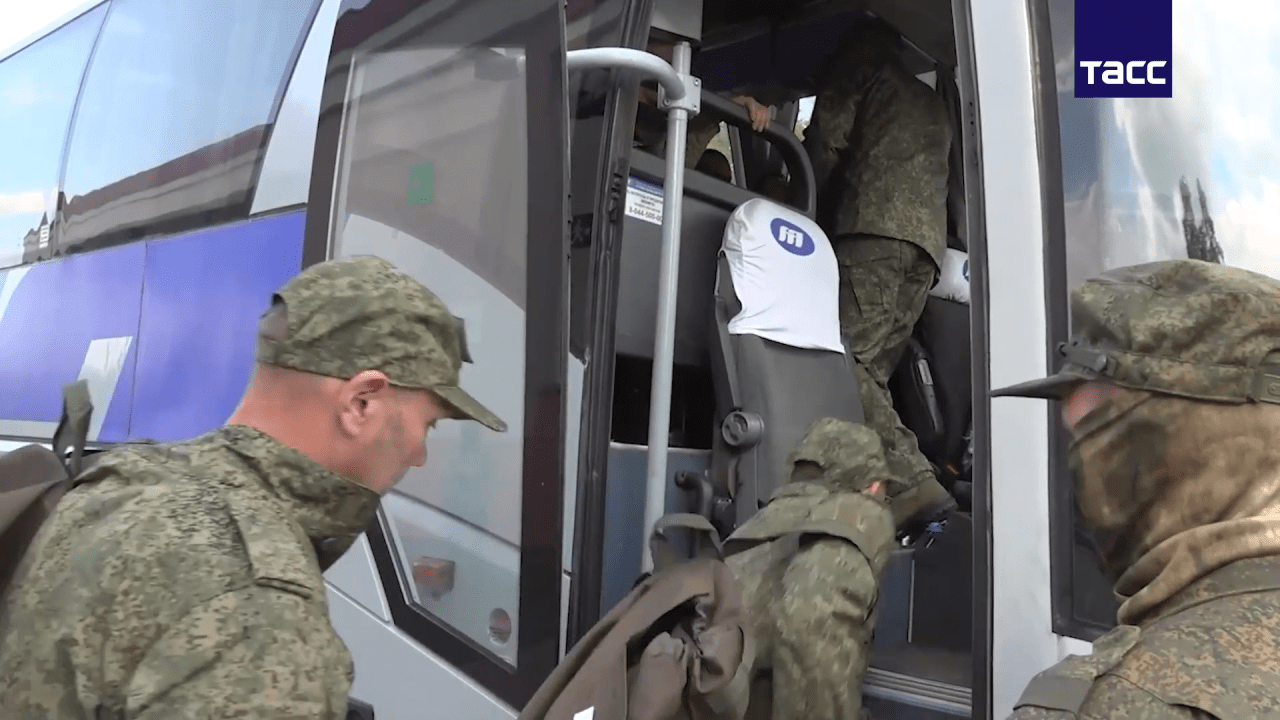 A still image from a video shows POWs boarding a bus after an exchange in May. (Sasha Maslov for WSJ)