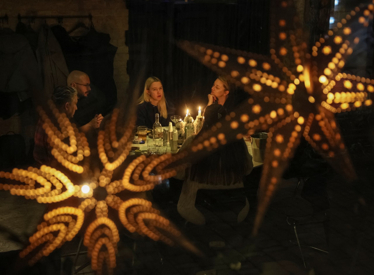 A candlelit cafe during a blackout in Kyiv.