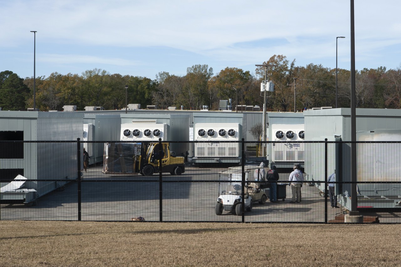 Employees work on electrical structures for data centers at the Minden facility this month.