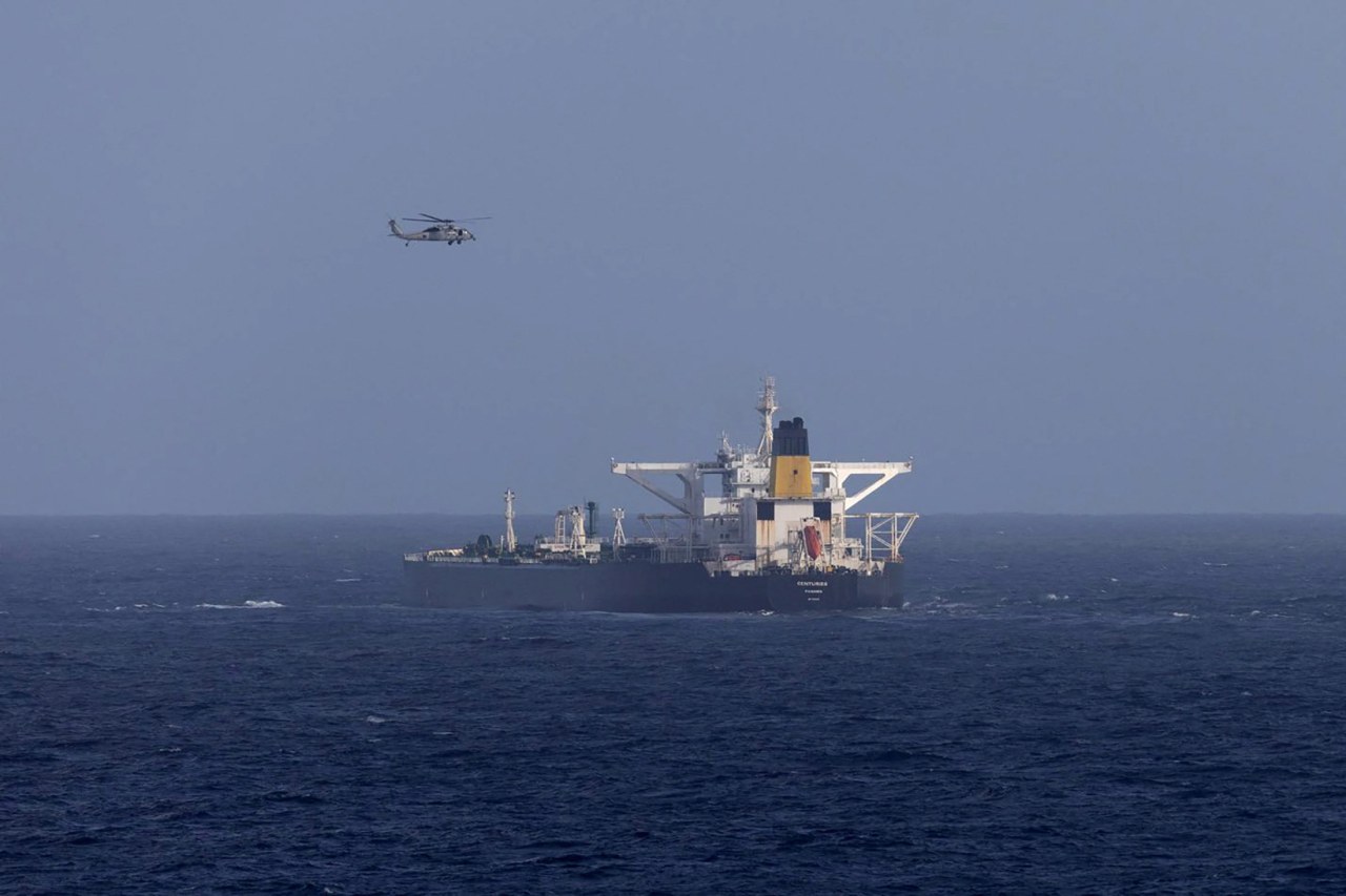 A U.S. military helicopter flies over the Centuries oil tanker, which was intercepted by the U.S. Coast Guard.