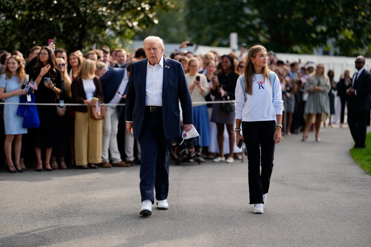 Trump walking with granddaughter Kai Trump at the South Lawn of the White House in September.