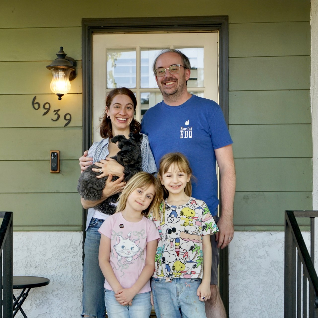 Greg and Sara Cebulski and their two children in front of their old home in California before moving to Wisconsin.