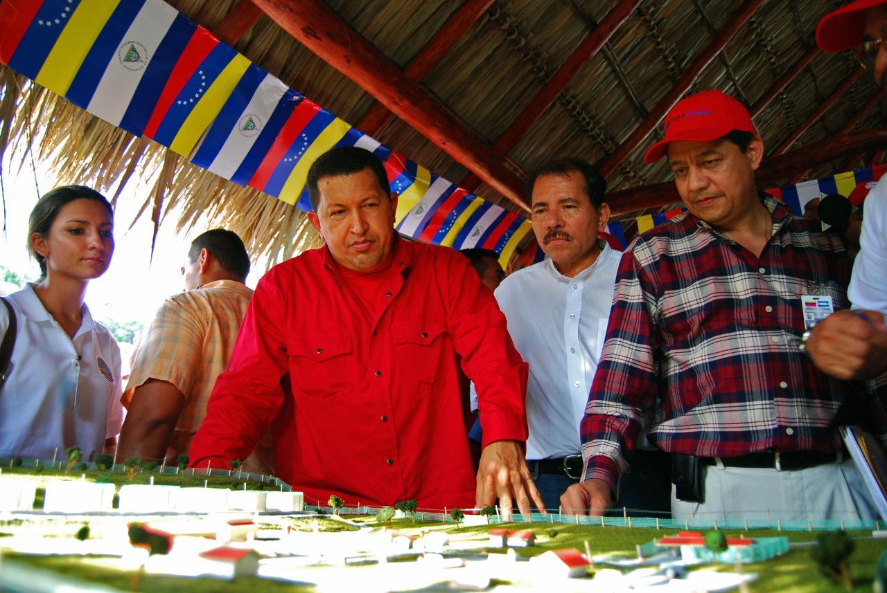 Venezuelan President Hugo Chávez, with Nicaraguan President Daniel Ortega, examines a model of a proposed oil refinery in 2007.
