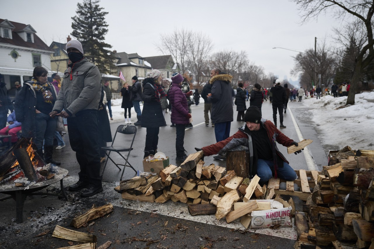 People at the memorial site for Good.