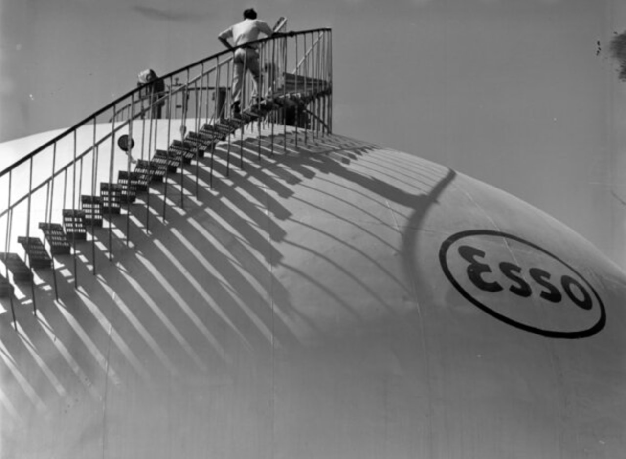 Workers accessing the top of an Esso oil storage tank at Puerto La Cruz, Venezuela, in 1944.