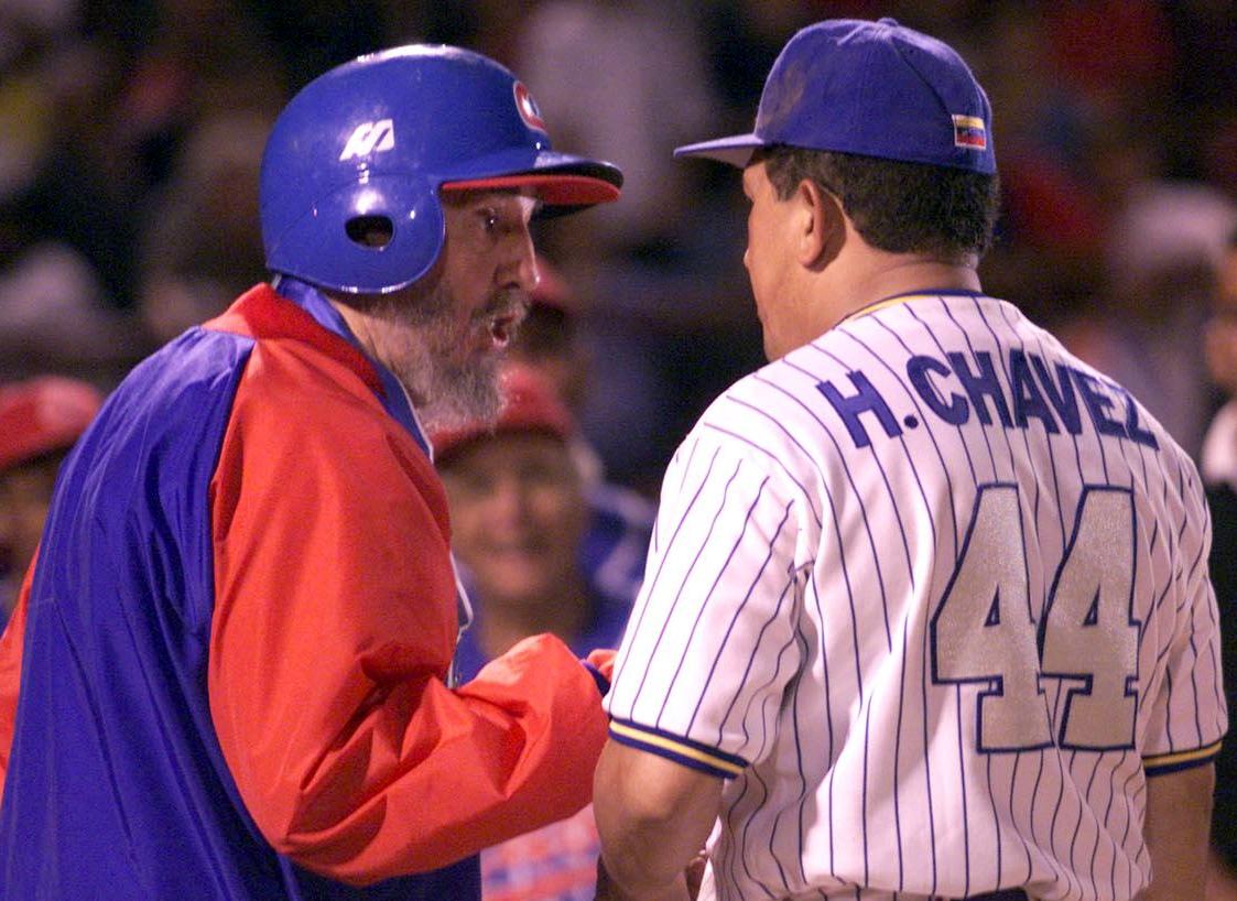 Fidel Castro chats with Hugo Chavez before a baseball game between the Cuban and Venezuelan teams in 2000. JUAN BARRETO/Agence France-Presse/Getty Images