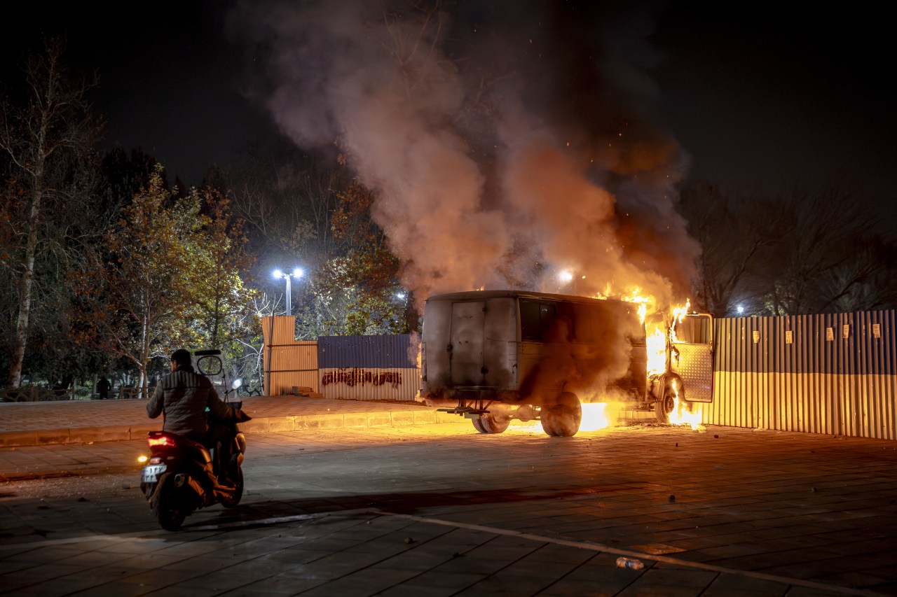 A vehicle burns during protests in Tehran on Jan. 8.