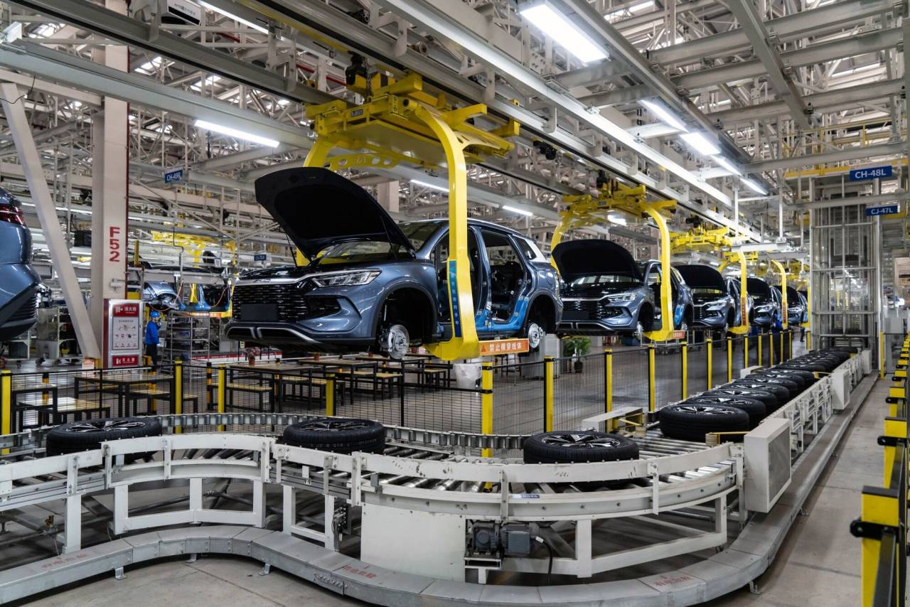 Electric vehicles on the assembly line at the BYD factory in Zhengzhou, China. Electric vehicles on the assembly line at the BYD factory in Zhengzhou, China.