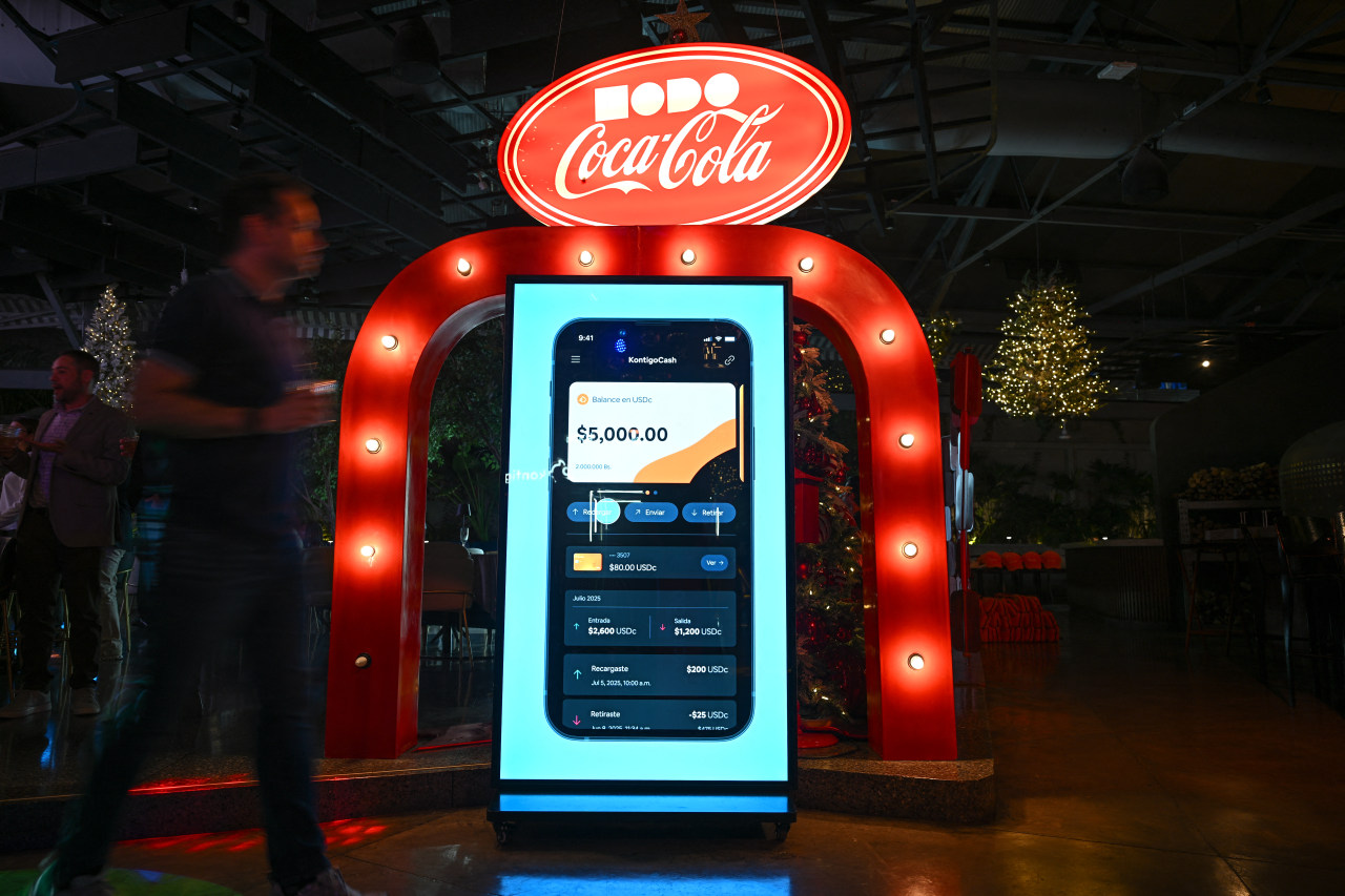 A large screen displaying the Kontigo cryptocurrency app.