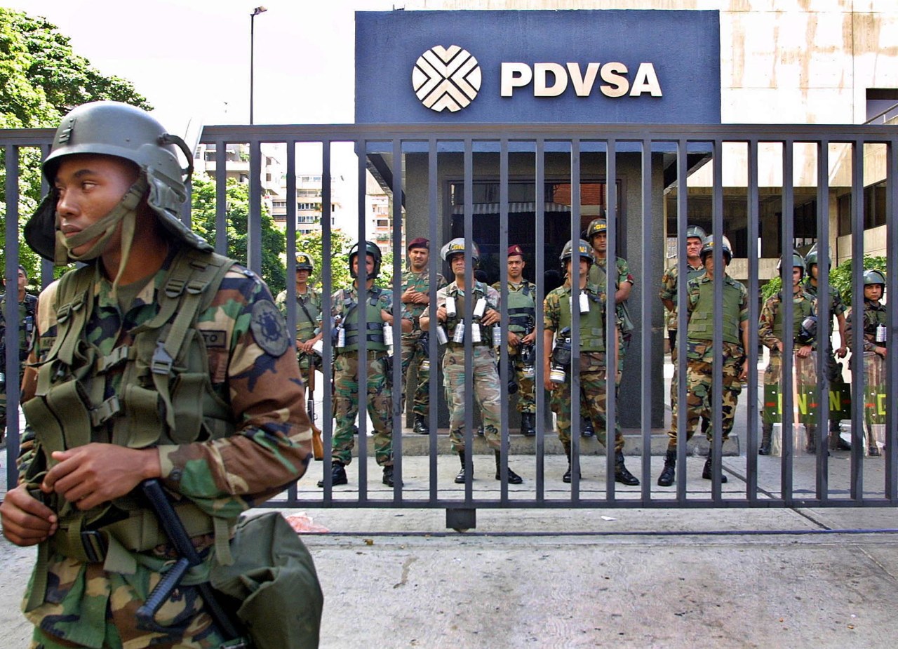 Venezuelan troops stood outside PdVSA offices during a strike in late 2002..