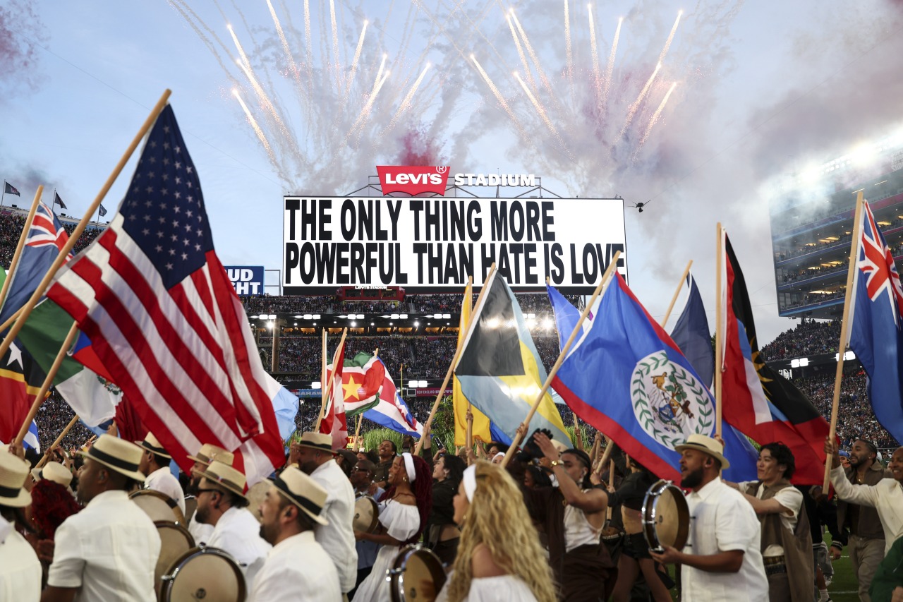 At the end of Bad Bunny’s halftime performance, a crowd hoisted the flags of nations across Latin America.