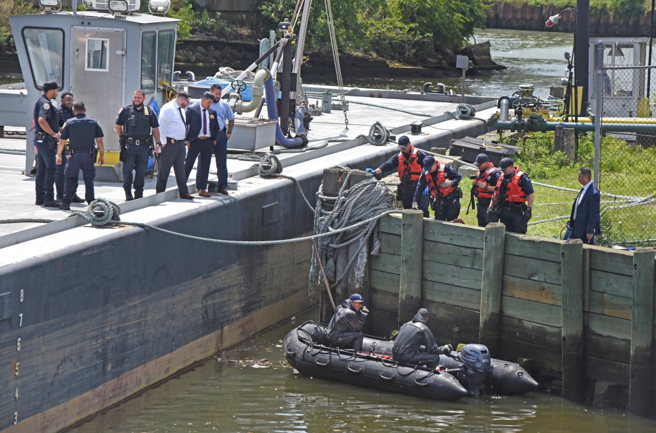 New York police officers retrieve a body from Newtown Creek on Aug. 1, 2023, days after a Brooklyn Mirage customer went missing after leaving the club.