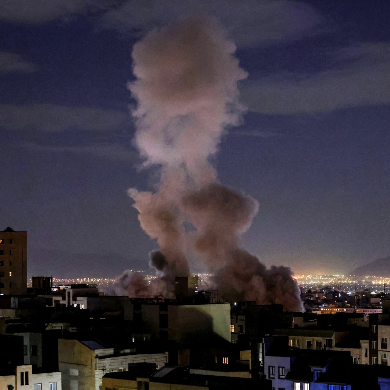 A smoke plume rose following a missile strike in Tehran. A smoke plume rose following a missile strike in Tehran.