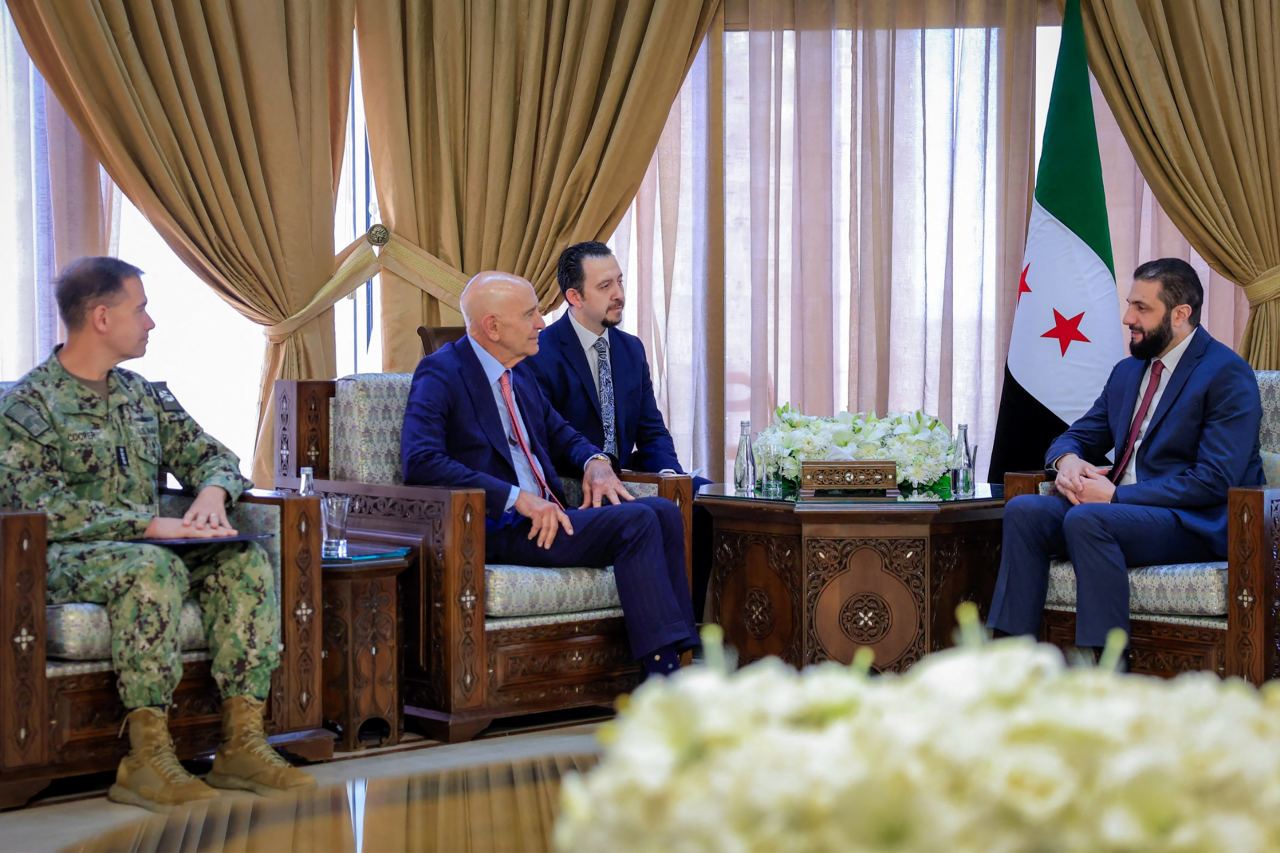 Syria's interim President Ahmed al-Sharaa, right, meeting in Damascus last year with U.S. officials including Adm. Brad Cooper, left, in a photo provided by the Syrian government.