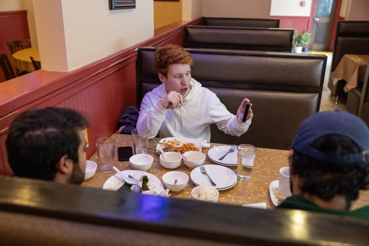 Brundage shows friends a TV box he tested during his investigation.