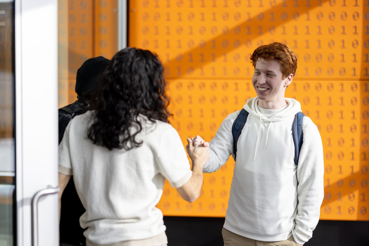 Brundage greets friends on campus.