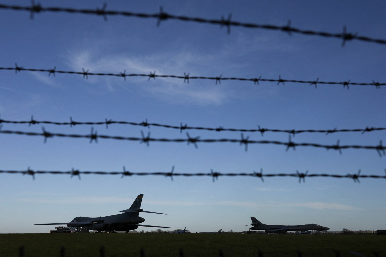 B‑1B Lancer military aircraft parked on the tarmac at RAF Fairford air base in Britain.