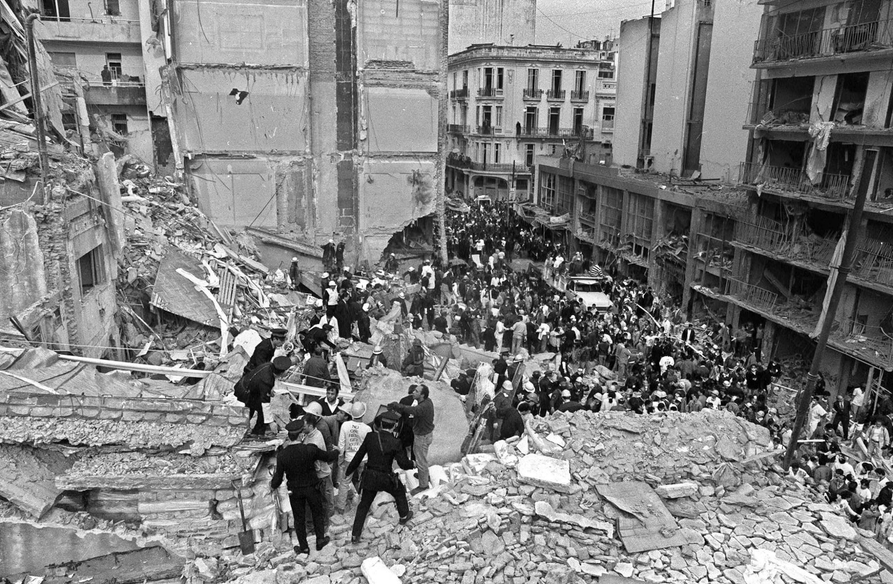 Rescuers search through the wreckage after a 1994 bombing at a Buenos Aires Jewish center that killed 85 people. Rescuers search through the wreckage after a 1994 bombing at a Buenos Aires Jewish center that killed 85 people.