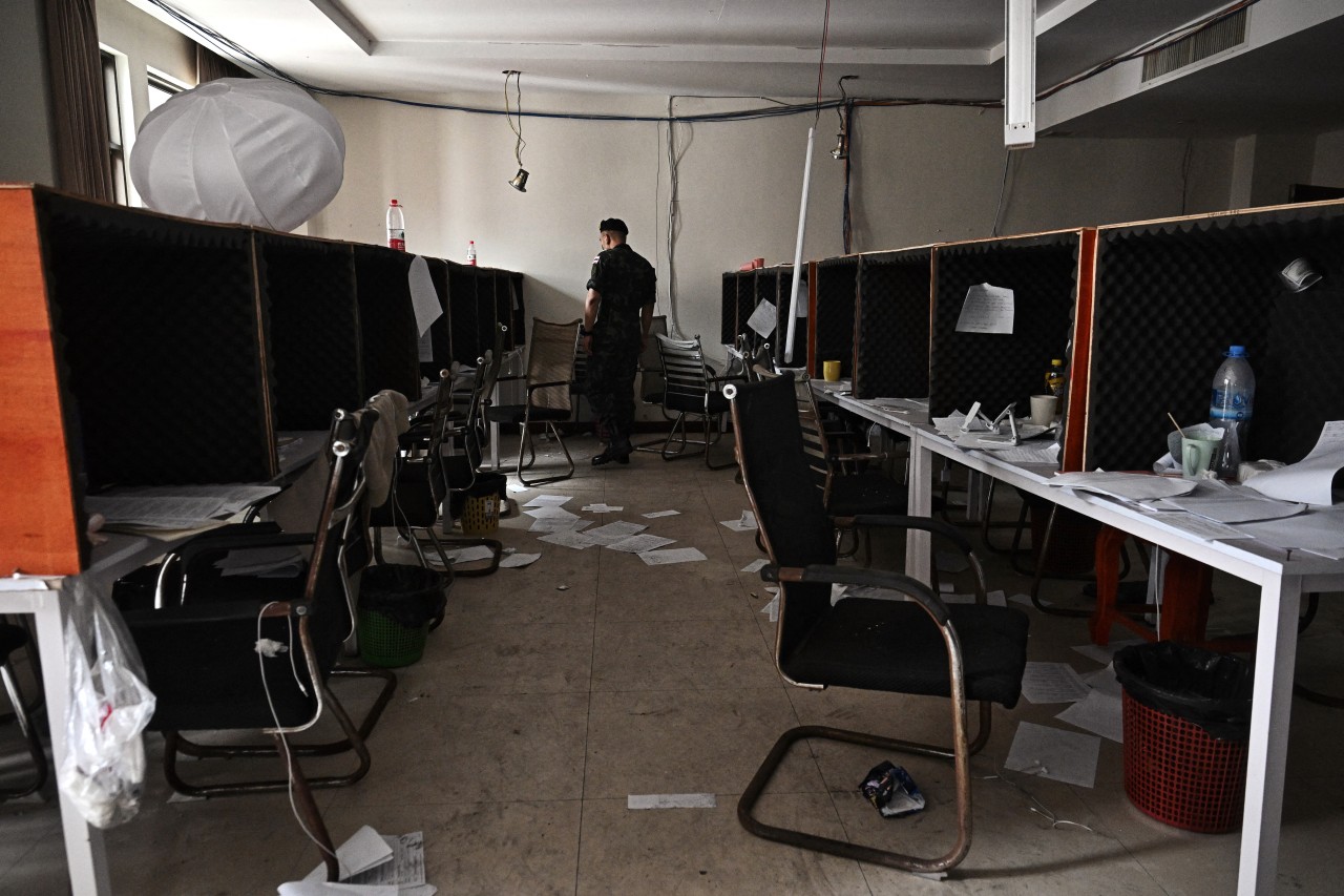 An army officer surveying an abandoned cyber-scam office in a Cambodian town near the Thailand border last month.