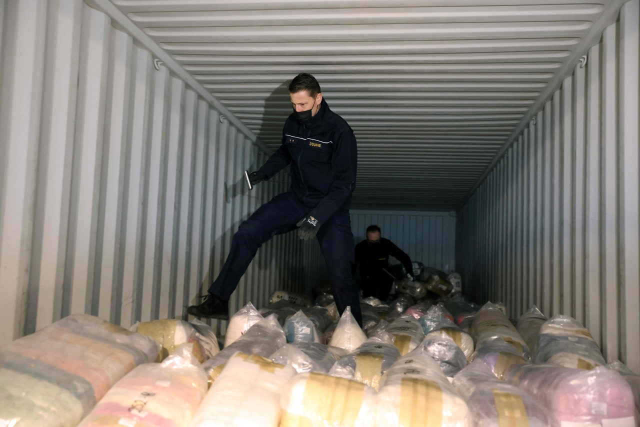 Belgian customs officers search for drugs in a container at Antwerp's port.